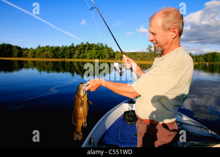 Mature man bass fishing in a lake Stock Photo