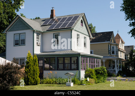 Photovoltaic solar panels on roof of  house Stock Photo