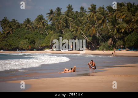 young woman posing for a foto at the beach in Mirissa, Sri Lanka Stock Photo