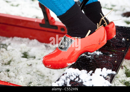 Oudemirdum, Close up of wooden shoes or clogs belonging to rider of antique horse sledge. The straw keeps the feet warm. Stock Photo