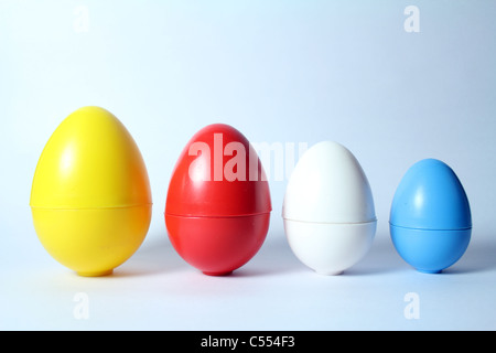 Conceptual shot of plastic eggs in different sizes Stock Photo