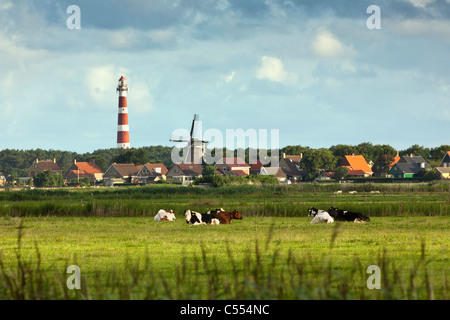 The Netherlands, Hollum on Ameland Island, belonging to Wadden Sea Islands. Unesco World Heritage Site. Lighthouse and skyline. Stock Photo