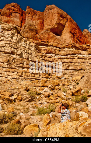 Man observing Parowan Gap Petroglyphs listed on the National Register of Historic Places near Cedar City, Utah Stock Photo