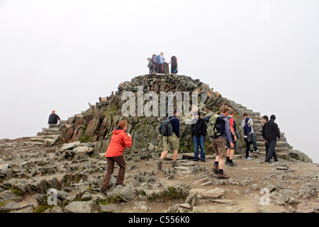 Walkers on the summit of Snowdon, Snowdonia National Park Wales UK Stock Photo