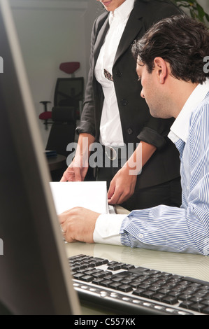 Manager talking to employee Stock Photo