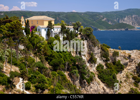 Greek Orthodox Monastery of the Virgin Mary perched high on top of cliffs near Paleokastritsa, Corfu, Greece Stock Photo