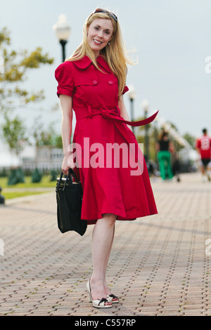 USA, New Jersey, Jersey City, Smiling woman holding briefcase Stock Photo