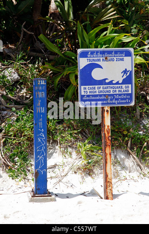 Tsunami hazard zone warning sign on Maya Bay where The Beach was filmed, Ko Phi Phi Ley, Phuket, Thailand Stock Photo