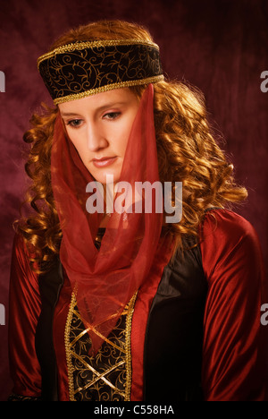 Serious Victorian woman looking down Stock Photo