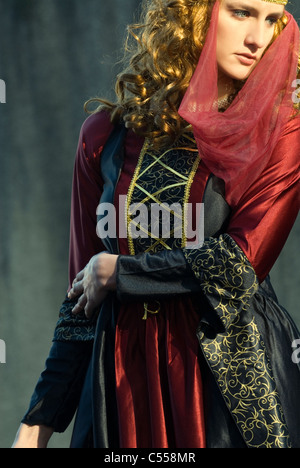 Medieval woman standing outdoors Stock Photo