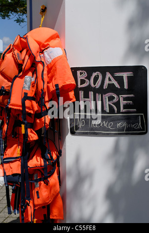 Boat hire sign 'no license required' and lifejackets Stock Photo