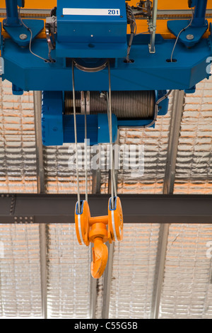 Low angle view of an overhead crane in a factory Stock Photo