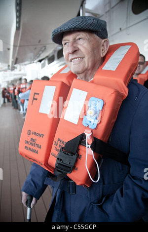 Senior citizen participating in safety exercise on the cruise ship MSC Orchestra. Stock Photo