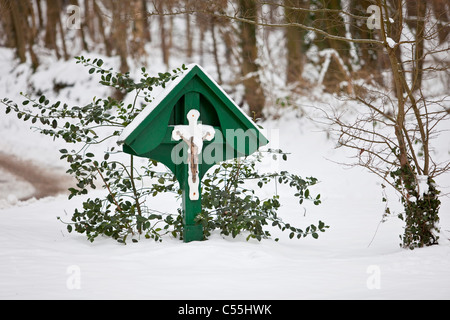 The Netherlands, Slenaken, Statue of Jesus Christ. Winter, snow Stock Photo
