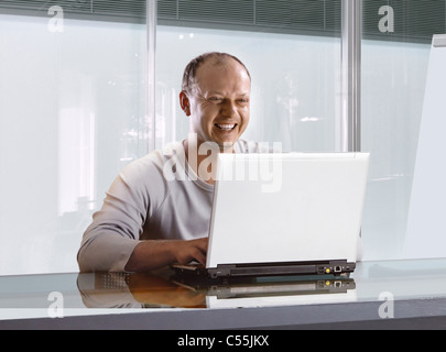 happy businessman in the office who working on the notebook Stock Photo