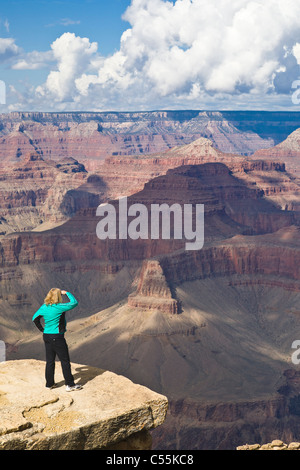 Tourist woman looking out over Hopi Point, Grand Canyon National Park, Arizona Stock Photo