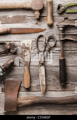 Old rusty tools on wooden background Stock Photo