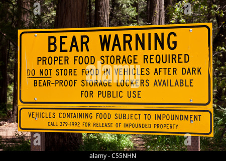 Bear warning signs for bear-proof food storage bins Yosemite national park California USA Stock Photo