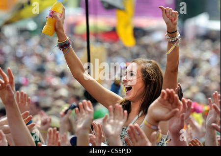 A fan of the singer Jessie J enjoys her performance on the Other Stage at the Glastonbury Festival 2011 Stock Photo