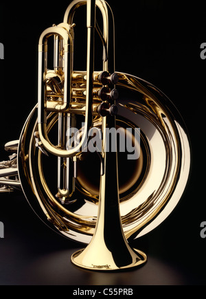 Brass trumpet and french horn on black background, studio shot Stock Photo