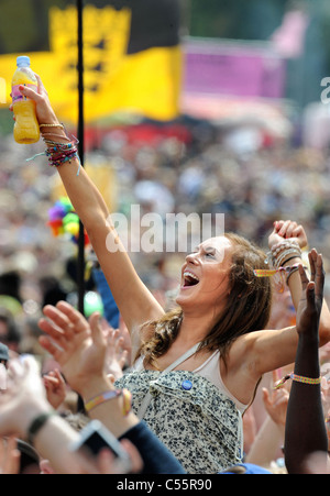 A fan of the singer Jessie J enjoys her performance on the Other Stage at the Glastonbury Festival 2011 Stock Photo