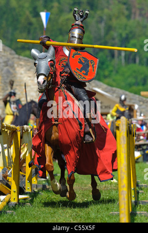 historical knight in fight on horse while a show in Germany Stock Photo