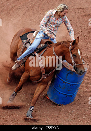 Woman competing in the barrel racing event at the Annual Indian Rodeo held in Mescalero, New Mexico. Stock Photo