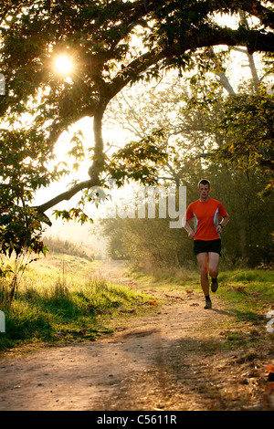 Man running at sunset in a park, San Clemente Canyon, San Diego County, California, USA Stock Photo