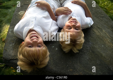 Two boys playing in a park Stock Photo