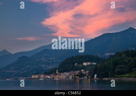 Distant view over the lake Como to Bellagio historic center in the evening Stock Photo
