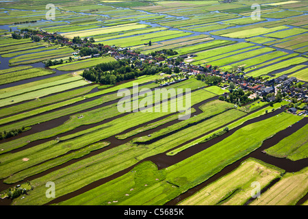 Netherlands, Wormer, Polder with village and farmland. Aerial. Stock Photo