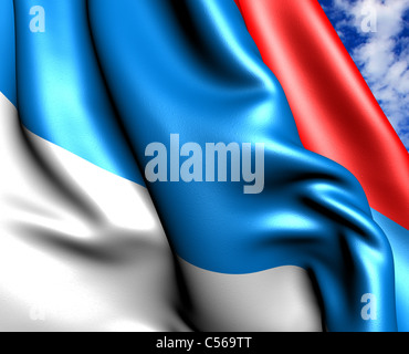 Flag of Serbia against cloudy sky. Close up. Stock Photo