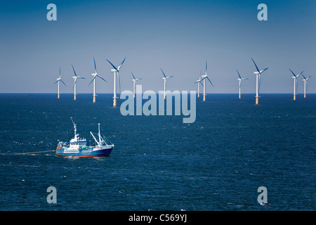 The Netherlands, IJmuiden, Aerial view of wind turbines park called Offshore Windpark Egmond aan Zee or Princess Amalia. Fishing boat. Aerial. Stock Photo