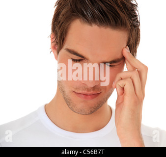 Attractive young man suffers from a headache. All on white background. Stock Photo