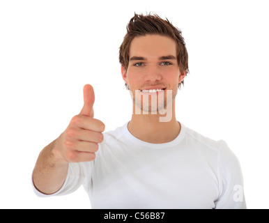 Attractive young man showing thumbs up. All on white background. Stock Photo