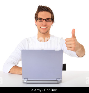 Smiling young guy using notebook computer. All on white background. Stock Photo