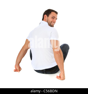relaxed man sitting on the floor on white background Stock Photo - Alamy