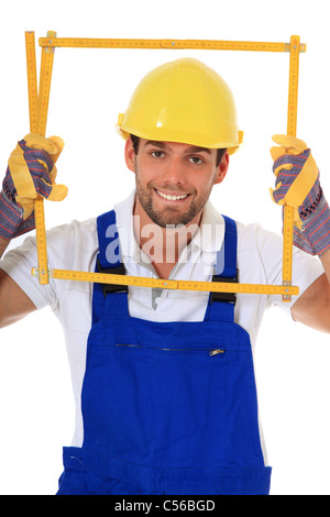Clumsy manual worker. All on white background. Stock Photo