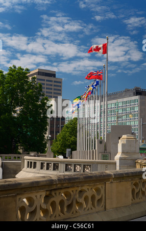 Provincial flags of Canada in downtown Ottawa from Sappers Bridge over the Rideau Canal in summer Stock Photo
