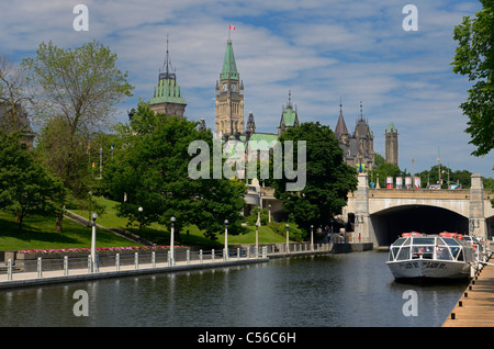 View of the Ottawa Parliament Buildings from the Rideau Canal in summer Stock Photo