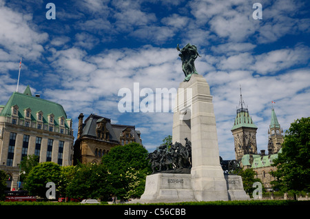 National War Memorial in Confederation Square in downtown Ottawa with Parliament Buildings Canada capital city Stock Photo