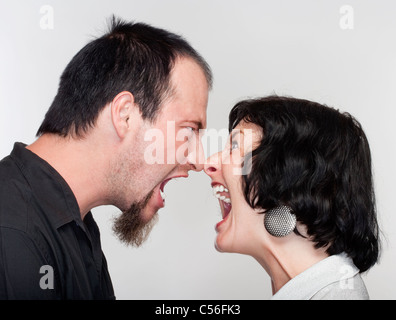 couple fighting, yelling at each other - isolated on white Stock Photo