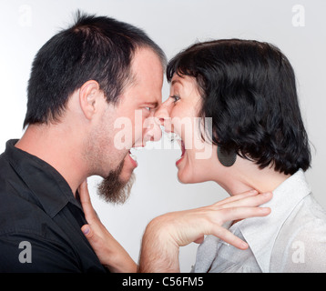 couple fighting, yelling at each other - isolated on white Stock Photo