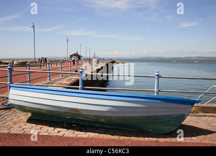 Morecambe, Lancashire, England, UK, Britain. Boat and view along the renovated stone jetty to the bay on the English north coast Stock Photo