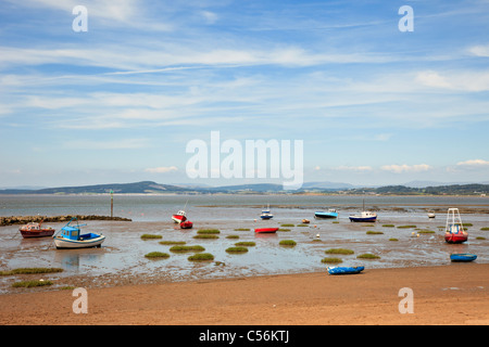 Beached boats on the sands at low tide with view across Morecambe Bay on north west coast. Morecambe Bay, Lancashire, England, UK, Britain Stock Photo