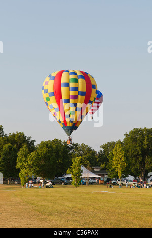 Hot Air balloons landing at Gulf Coast Hot Air Balloon Festival, Foley, Alabama Stock Photo