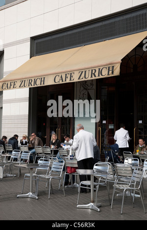 Waiters serving at Cafe Zurich in Praca de Catalunya Square in Barcelona, Catalonia, Spain Stock Photo