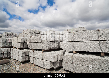 Inventory piles of white granite curbstones , Finland Stock Photo