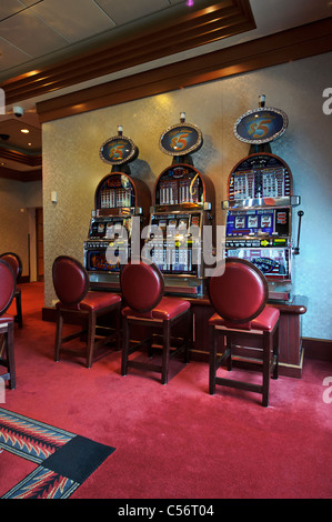 Slot machines in the Empire Casino on the Cunard Queen Mary 2 Ocean Liner. Stock Photo