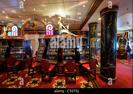 Slot machines in the Empire Casino on the Cunard Queen Mary 2 Ocean Liner. Stock Photo